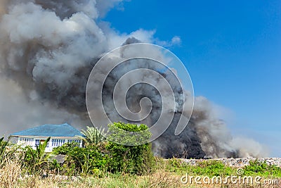 Billowing Black Smoke from ignition midden Stock Photo