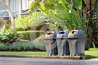 Bin, trashcan, plastic waste bin clear trash sideways walk at garden public, bin waste, plastic bin garbage Stock Photo