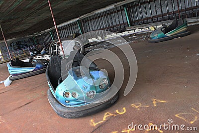 Blue Bumper Cars in an Abandoned Amusement Park Editorial Stock Photo