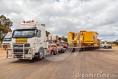 BINDOON, AUSTRALIA - Oct 13, 2012: Oversize loads of mining machinery are transported by truck to the iron ore mines in the Editorial Stock Photo