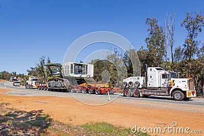 BINDOON, AUSTRALIA - Sep 15, 2012: Oversize loads of mining machinery are transported by truck to the iron ore mines in the Editorial Stock Photo