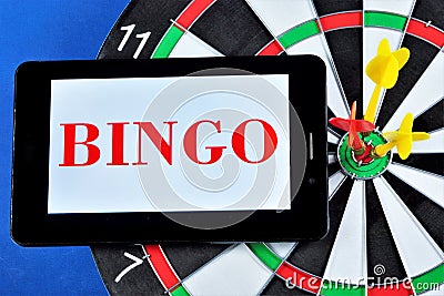 Bingo is a popular gambling game and Darts entertainment. Bingo is a game in which numbers are randomly chosen for good luck. Stock Photo