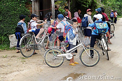 Asian pupil cycling go to school Editorial Stock Photo