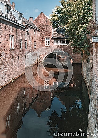 The Binnendieze is a small river that is enclosed within the Den Bosch city and therefore runs mostly underground Stock Photo