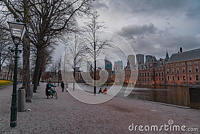 Binnenhof castle (Dutch Parliament) with the Hofvijver lake against a background of skyscrapers Editorial Stock Photo