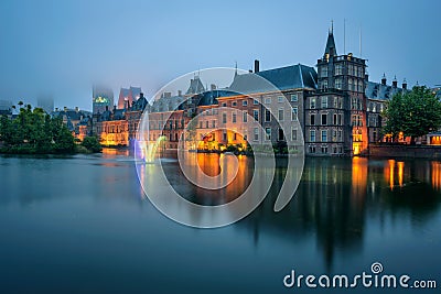 The Binnenhof palace in a foggy evening in Hague, Netherlands Stock Photo