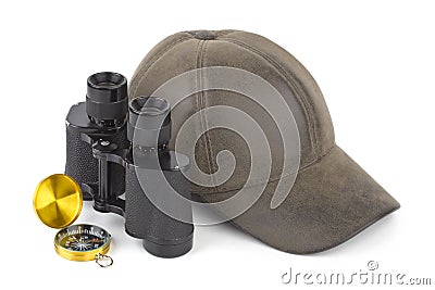 Binoculars, compass and cap Stock Photo