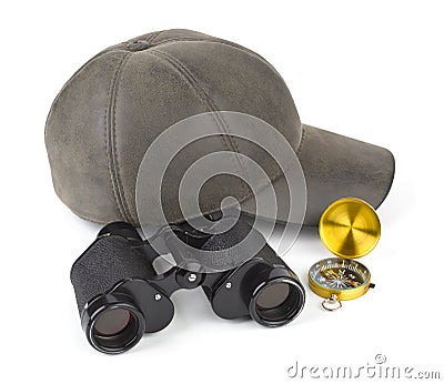 Binoculars, compass and cap Stock Photo