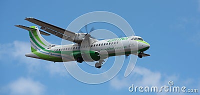 Binter Canarias Airlines flies in the blue sky. Landing at Tenerife Airport Editorial Stock Photo