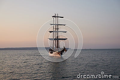 Binz, Germany - July 22, 2021 - The Loth LoriÃ«n is a three-masted barquentine flying the Dutch flag at dusk Editorial Stock Photo