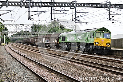 DB Cargo Class 66 66004 working a Dollands Moor Sidings to Ditton Foundry Lane approaches Rugeley Trent Valley on 28 June 2023 Editorial Stock Photo