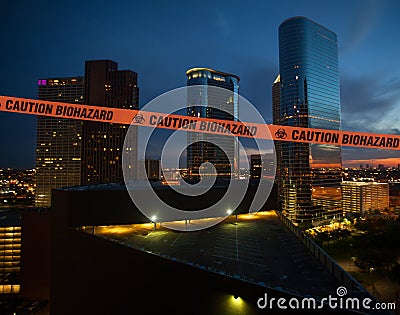 Biohazard tape across a city skyline Stock Photo