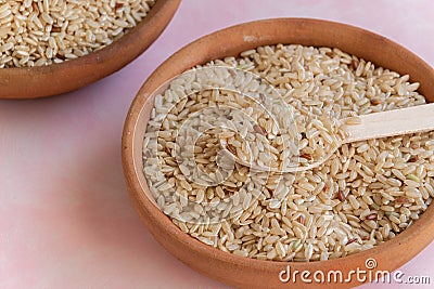 Biological brown rice,uncooked cereal ingredient Stock Photo