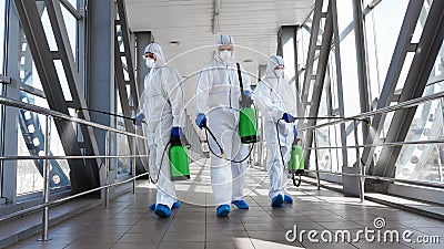 Men in a protective suit and mask disinfecting tunnel with gas Stock Photo