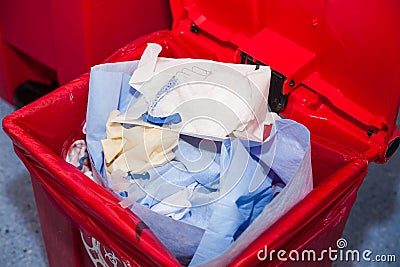 Biological risk waste disposed of in the red trash bag at a operating room Stock Photo