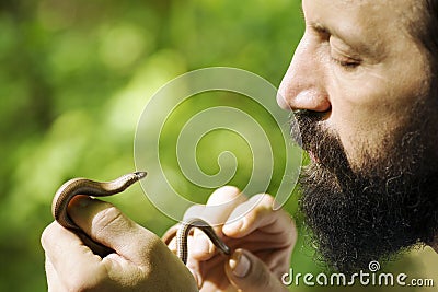 Biologist holding little snake Stock Photo