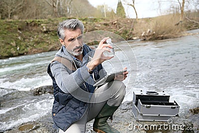 Biologist making research outdoors Stock Photo