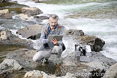 Biologist researcher checking the water quality Stock Photo