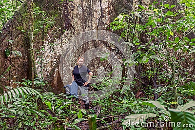 Biologist Woman Standing Next To A Kapok Tree Stock Photo