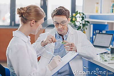 Biologists with petri dish Stock Photo