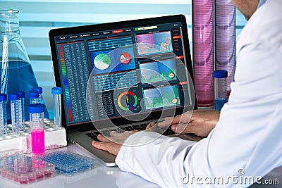 Biomedical engineering working with computer in laboratory Stock Photo