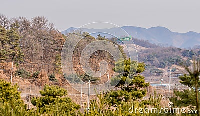 Biplane flying over mountainous region Editorial Stock Photo