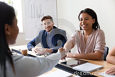 Biracial company executive manager handshake african client starting business meeting Stock Photo