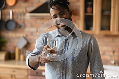 Biracial man recommend drinking clean mineral water Stock Photo