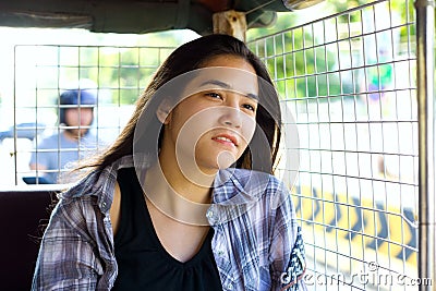Teen girl riding tuktuk taxi in Cambodia Stock Photo
