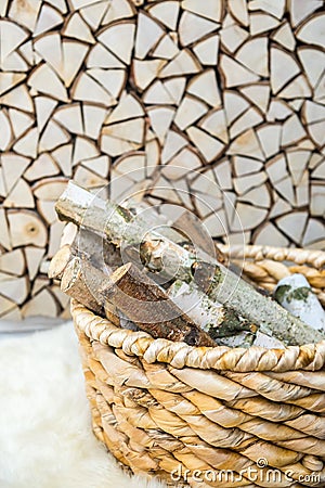 Birch firewood in the wooden basket Stock Photo