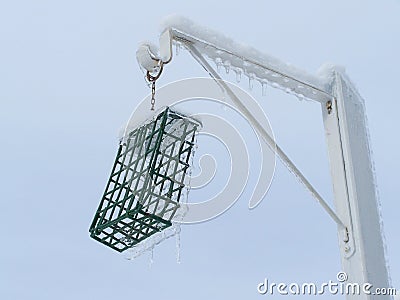 Bird feeder covered of ice after an ice storm-Stock Photos Stock Photo