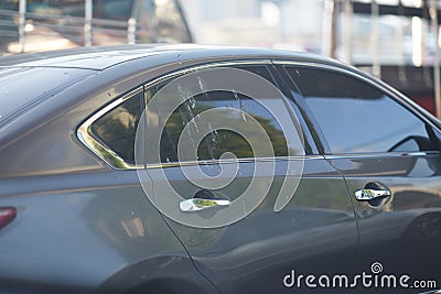 Bird poop splash on car win shield on street view Stock Photo