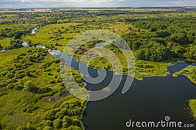 Bird`s-eye view of the bends of the river meadows and fields Stock Photo