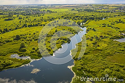 Bird`s-eye view of the bends of the river meadows and fields Stock Photo