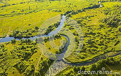 Bird`s-eye view of the bends of the river meadows and fields Stock Photo