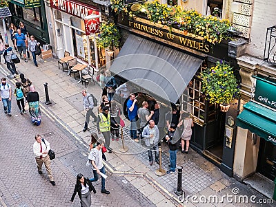 Bird's-eye view of London pub, patrons outside Editorial Stock Photo