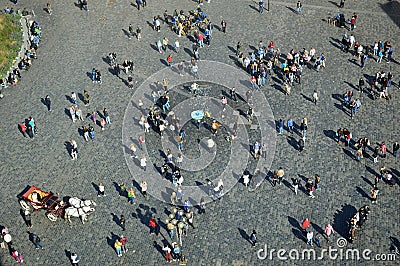 Bird`s eye view of Prague sightseers in the old town square Editorial Stock Photo