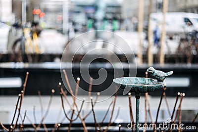 Bird-shaped Street Water Drinker for Urban Wildlife Stock Photo