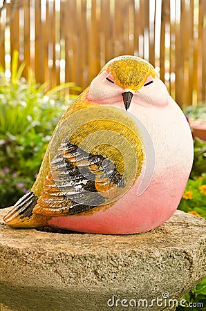Bird statue in garden Stock Photo