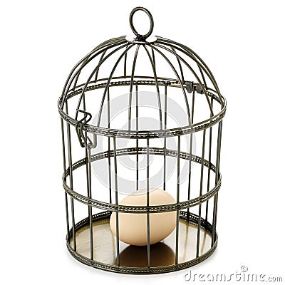 Birdcage and egg Stock Photo