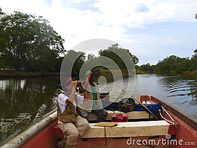 Birders in the outdoors birdwatching during Global Shorebird Counting Program Editorial Stock Photo