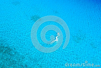 Birds eye view of jet ski riding at blue tropical ocean Stock Photo