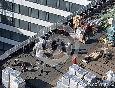 Birds eye view of a roof construction site. Professional bitumen waterproofing on a flat building Editorial Stock Photo