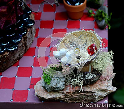 Birds in Faerie Garden Birdbath Stock Photo