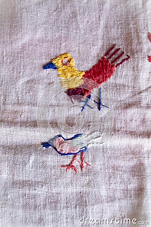 Birds handmade embroidered smooth decoration on white fabric , vintage folk embroidery in Belarus, second half of 19 Stock Photo