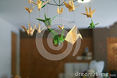 A birds mobile by paper work. Stock Photo