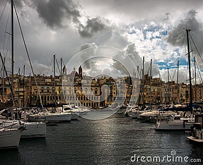 Birgu. Kalkara. Bormla. Boat mooring. Yachts. Clouds over Valletta. Malta. Editorial Stock Photo
