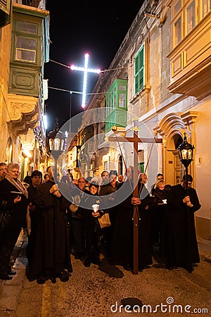 Night Christian procession through the streets of the old Maltese city Editorial Stock Photo