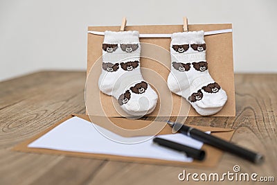 Birth greeting card with baby socks Stock Photo