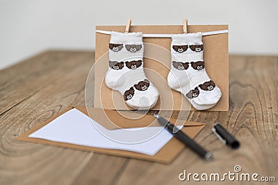 Birth greeting card with baby socks Stock Photo